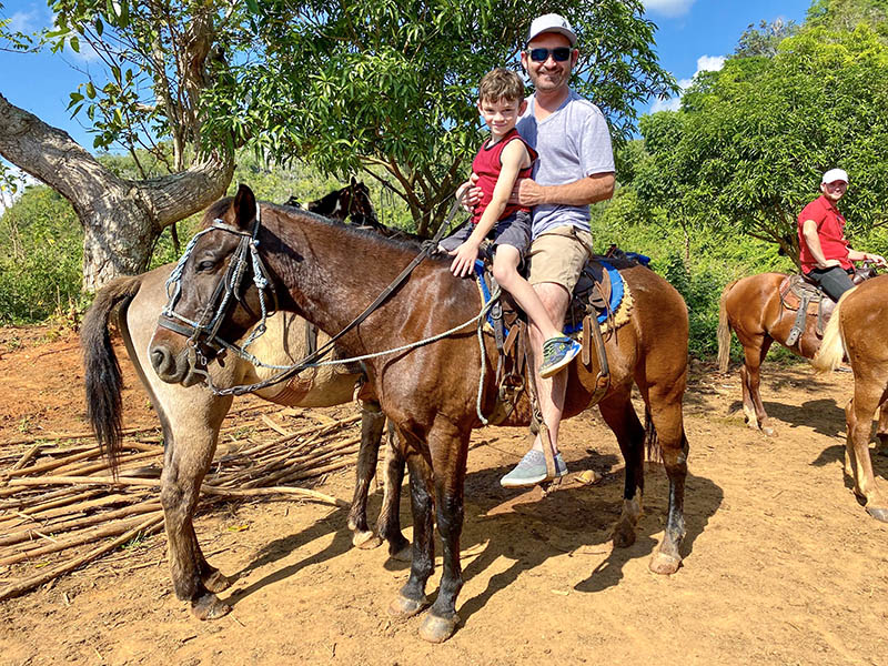 Saddled up and ready to ride horses through Vinales Valley
