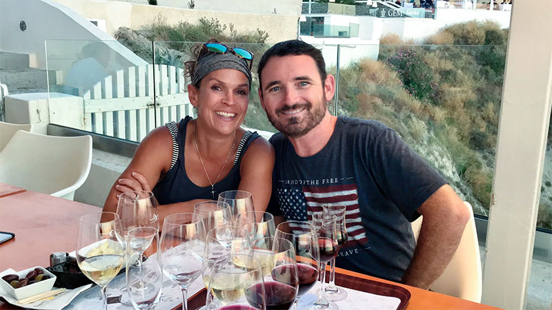 Cody and Craig tasting wine at Santo Winery at sunset