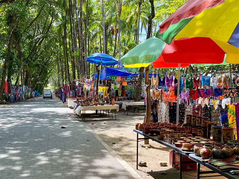 Color tented vendor tables at the Dominical Beach Market